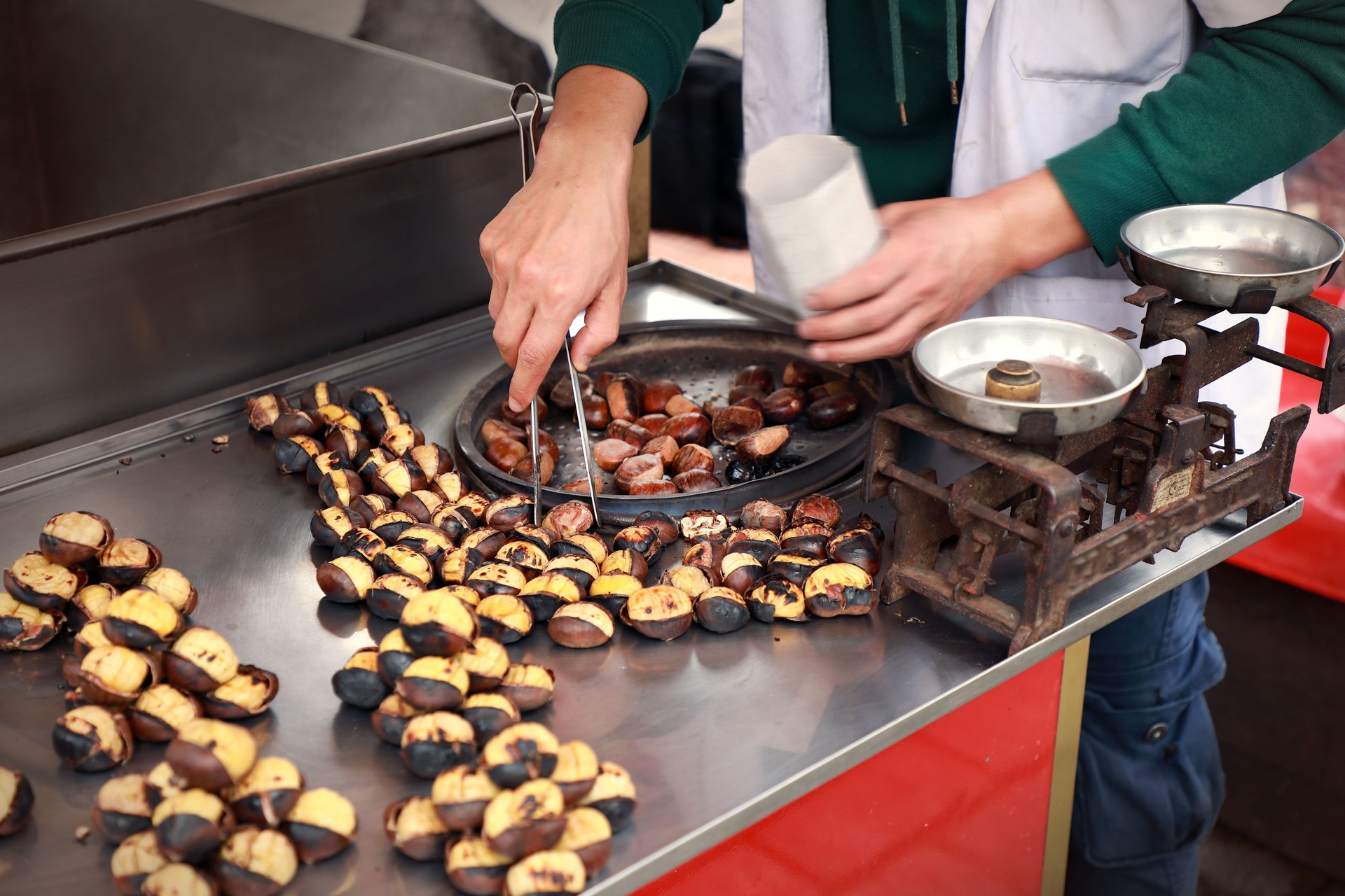 Street food of roasted chestnuts on food stall